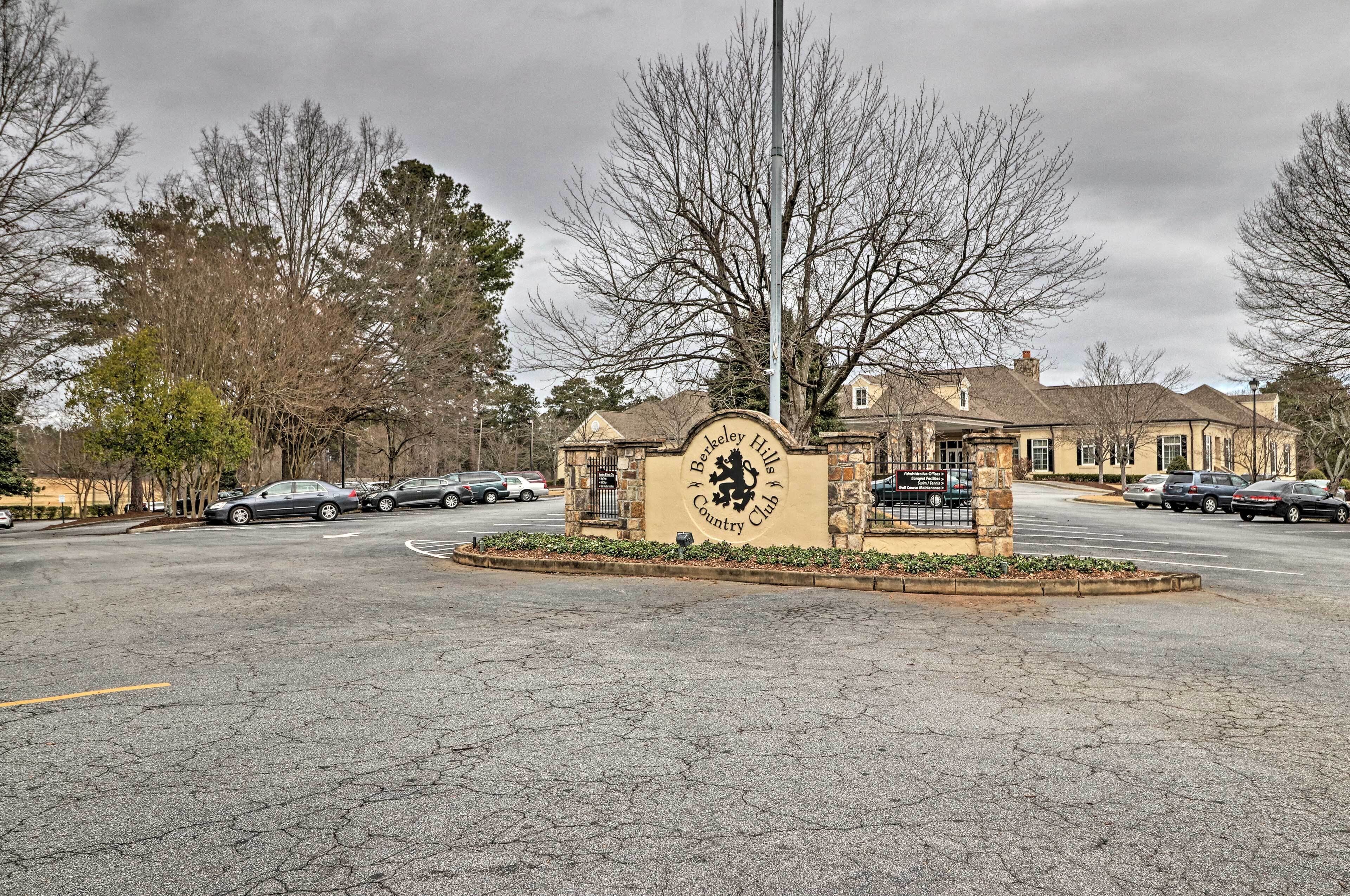A parking lot with a sign for the Barley Hills Country Club.