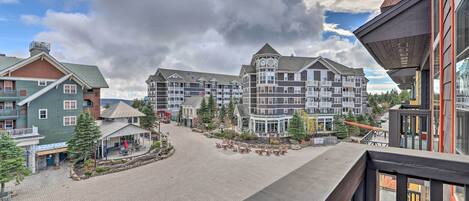 A hotel with a central courtyard, multiple buildings, and a prominent clock tower.