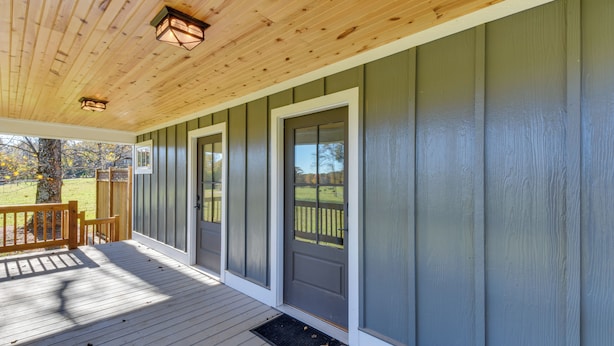 A covered porch with a wooden ceiling and a view of a grassy yard. - Modern Clarkesville Cottage w/ Decks & Patio! (Clarkesville)