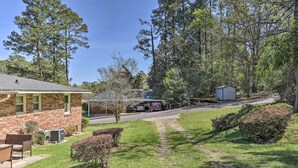A residential property with a brick house, a covered patio, and a small shed. - Spacious Retreat ~ 1 Mile to Augusta National! (Augusta)