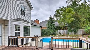 A wooden deck with a pool, surrounded by a white house and a wooden fence. - Martinez Retreat w/ Seasonal Pool: 9 Mi to Masters (Grovetown)