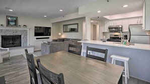 A modern kitchen with white cabinets, a built-in microwave, and a stainless steel refrigerator. - < 1 Mi to Slopes! 'heavenly Daze Chalet' in Tahoe (Stateline)