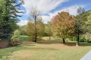 A grassy area with trees and a clear sky. - Hot Tub & Fire Pit: Pet-friendly Clayton Escape! (Clayton)