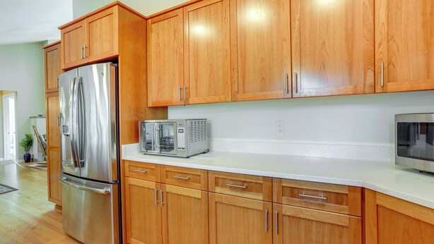 A kitchen with wooden cabinets, stainless steel appliances, and a white countertop. - Beautiful Seattle Home w/ Patio ~ 9 Mi to Downtown (Seattle)