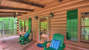 A wooden cabin with a porch, green shutters, and two rocking chairs. - Rural Dallas Gem w/ Hot Tub, Sauna + Fire Pit! (Dallas)