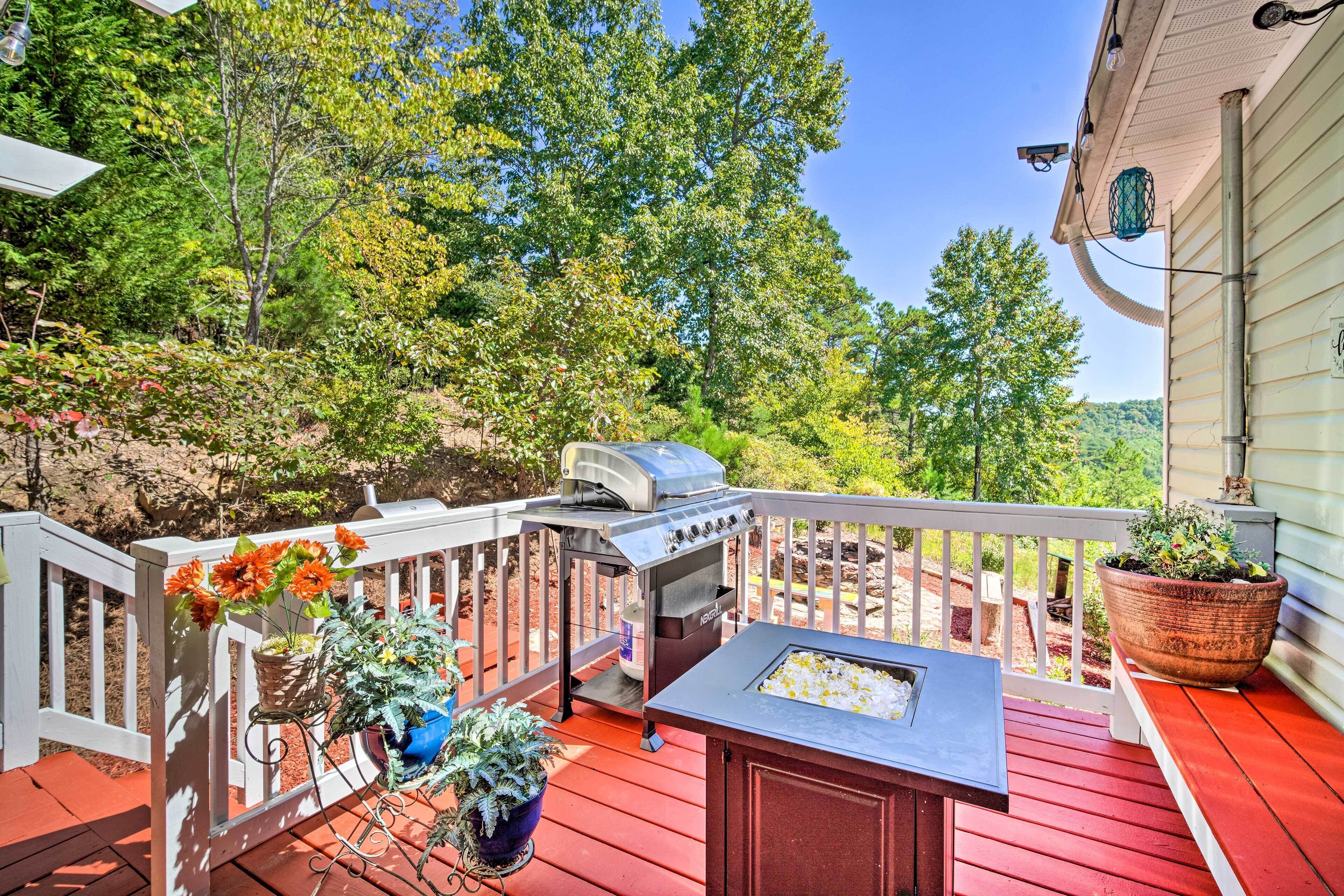 A wooden deck with a grill, potted plants, and a seating area.