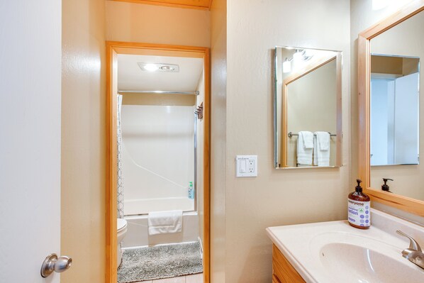 A bathroom with a sink, mirror, and shower area. - 2 Mi to Heavenly Mtn Resort: Retreat w/ Sauna! (Zephyr Cove)