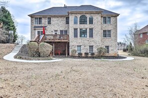 A two-story stone house with a balcony, a front door, and a small porch area. - Fayetteville Getaway ~ 23 Mi to Dtwn Atlanta! (Fayetteville)