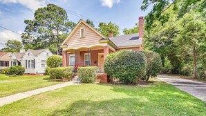 A two-story house with a brick facade, a front porch, and a well-maintained lawn. - Georgia Vacation Rental: 3 Mi to Downtown Columbus (Columbus)