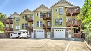 A row of townhouses with balconies, garage doors, and a parking area. - Hiawassee Haven on Lake Chatuge w/ Boat Slip! (Hiawassee)