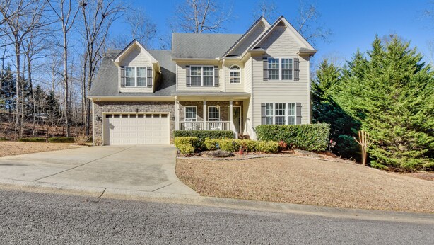 A two-story house with a garage, a front porch, and a well-maintained lawn. - Home w/ Deck ~ 7 Mi to Downtown Dahlonega! (Dahlonega)