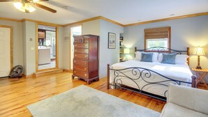 A bedroom with a bed, dresser, and ceiling fan. - Dock & Views! Waterfront Baisden's Bluff Home (Crescent)