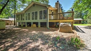 A two-story house with a large deck and a chimney. - Waterfront West Point Lake Cabin w/ Private Dock! (LaGrange)