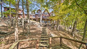 A wooden staircase leading to a cabin surrounded by trees. - Calhoun Cabin w/ River View + Wraparound Deck (Calhoun)