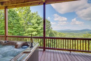 A hot tub on a wooden deck with a view of a forest and mountains. - Mineral Bluff 'bear Ridge Cabin' w/ Hot Tub! (Mineral Bluff)