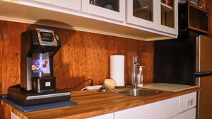 A kitchen with a coffee maker, a paper towel dispenser, and a sink. - 8 Mi to Broadway: Wfh-friendly Nashville Duplex! (Nashville)
