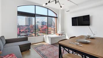 Panoramic Apartment | Living area | Flat-screen TV