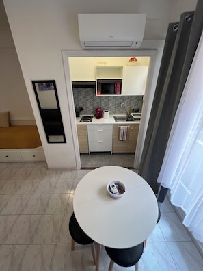 Fridge, microwave, stovetop, coffee/tea maker