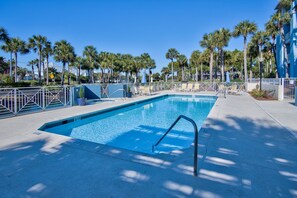 A rectangular swimming pool with a metal ladder, surrounded by palm trees and lounge chairs. - 30A Gulf Place Studio! 3 Pools, Pickleball & Prvt Beach, Fall Specials! (Santa Rosa Beach)
