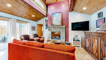 TV, fireplace, books