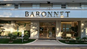 The exterior of a building with the name "BARONNET" prominently displayed above the entrance.