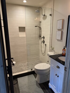 Shower, hair dryer, towels, soap