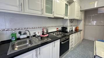 Apartment | Private kitchen | Full-size fridge, microwave, oven, stovetop