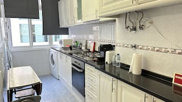 Apartment | Private kitchen | Full-size fridge, microwave, oven, stovetop