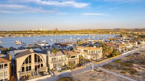 A coastal town with a marina, beachfront houses, and a clear view of the ocean. - Beach Break by Avantstay Oceanfront, View, Patio (Newport Beach)