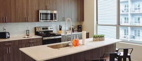 Coffee/tea maker, fridge, microwave, oven