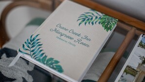 A brochure for Crane Creek Inn Mangrove Room in Melbourne, Florida. - Crane Creek Inn Mangrove Suite: Waterfront Pool! (Melbourne)