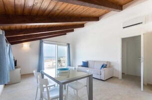 Panoramic Penthouse | Living area | 32-inch flat-screen TV with cable channels