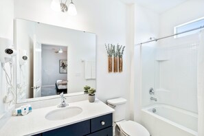 Shower, hair dryer, towels, shampoo