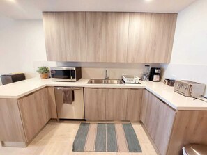 Fridge, microwave, oven, stovetop - Luxury Beachfront Condo at El Portillo Beach (El Limón)