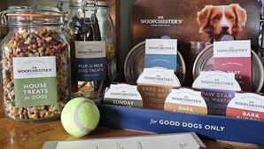 A table with various dog treats and a menu for dogs. - Dog and Partridge Inn (Calne)