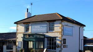 A building with a sign reading "DOG & PARTRIDGE". - Dog and Partridge Inn (Calne)