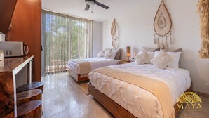 A modern hotel room with two beds, a ceiling fan, and a large window with sheer curtains. - NHOA 302C Lux 1BR Condo Top Jungle View Aldea Zama (Tulum)