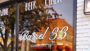 A storefront with a sign reading "Barrel 33" and "BEER CIDER" in large letters.