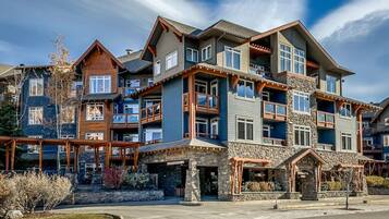 A multi-story hotel with a stone facade, balconies, and a sign reading "Blackstone."