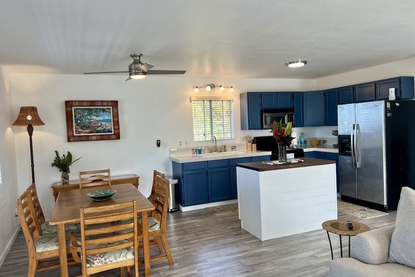 Another view of the dining area and the kitchen