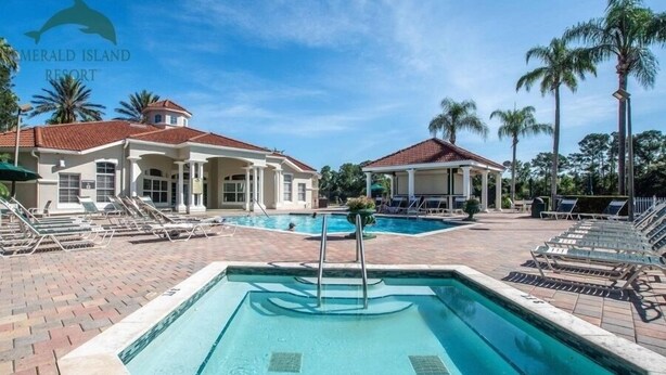 A resort with a swimming pool, lounge chairs, and palm trees. - 4BR Resort Home, 2 King Suites. Disney 9 min. Pools/Tennis/Pickleball/Gym/Sauna (Kissimmee)