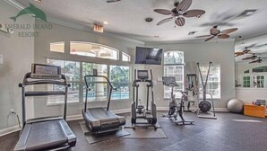 A gym with treadmills, elliptical machines, and free weights at Emerald Island Resort. - 4BR Resort Home, 2 King Suites. Disney 9 min. Pools/Tennis/Pickleball/Gym/Sauna (Kissimmee)