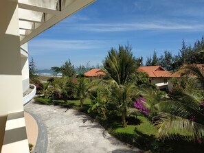 Deluxe Triple Room, Garden View | Garden view - Maxivic Beach Resort Phan Thiet (Phan Thiet)