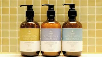 Three bottles of Authentic Organics products: Shampoo, Conditioner, and Body Wash.
