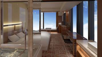 A modern hotel room with a large bed, a sitting area with a view, a small kitchen area, and a glass-enclosed jacuzzi.