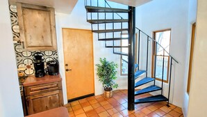 A kitchen with wooden cabinets, a coffee maker, and a potted plant. - Entire home with privacy and views 10 mins to town 25mins to ski area  (El Prado)