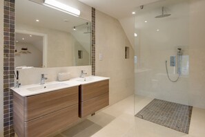 Shower, hair dryer, towels, toilet paper