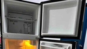 An open refrigerator with two door compartments and a freezer compartment. - Loft in the Heart of La Paz. 5 Blocks to Malecon Street (La Paz)