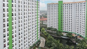 A high-rise residential building with multiple balconies and a central courtyard. - Capital O 93371 Pelangi Residence 5  (South Tangerang)