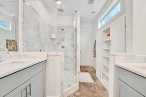 Shower, hair dryer, towels, shampoo